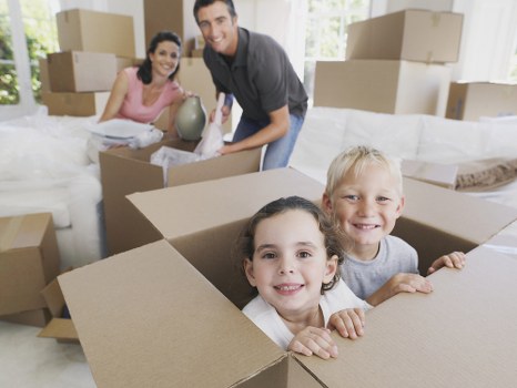 Movers loading household furniture carefully outside a Ruxley property