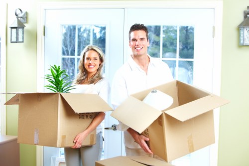 Local house removal team unloading boxes into a new home in Ruxley