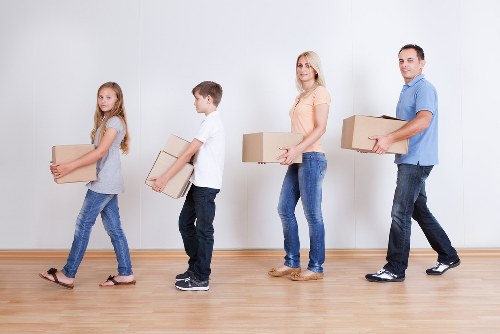 Local office movers preparing equipment for transport in Ruxley