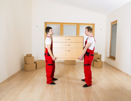Office items being loaded into a removal van for transport